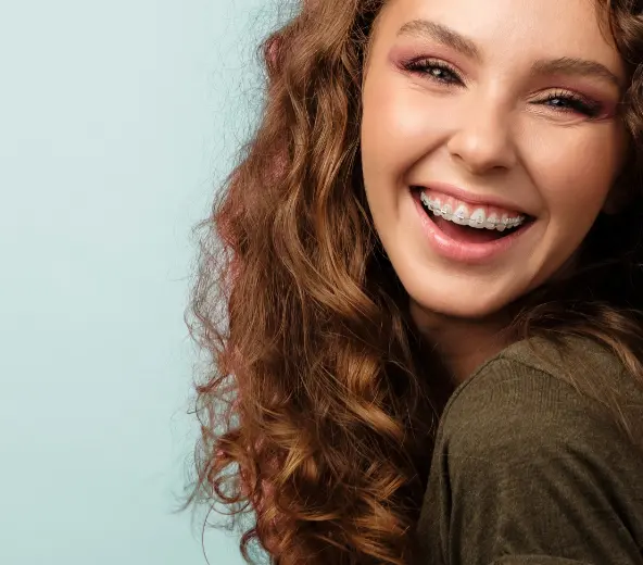 teen with braces smiling