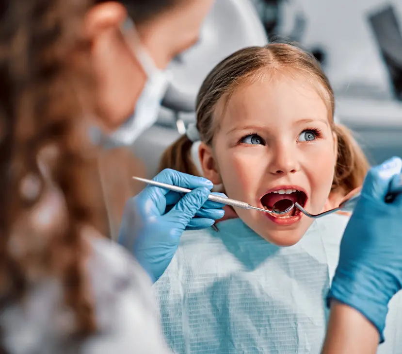 young girl having dental checkup